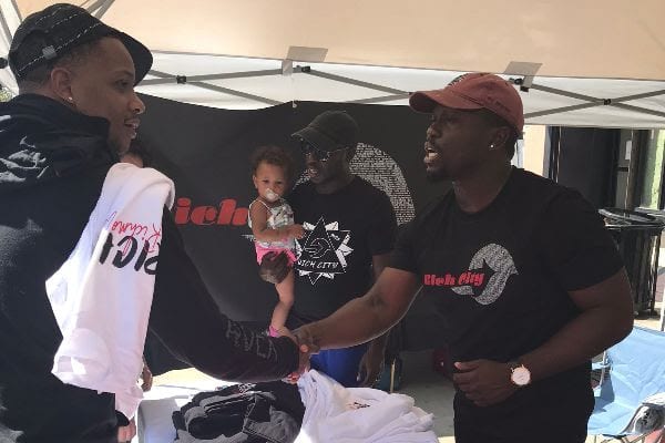 Rich City Apparel sealing a sale with a handshake at Spirit & Soul Festival 2019